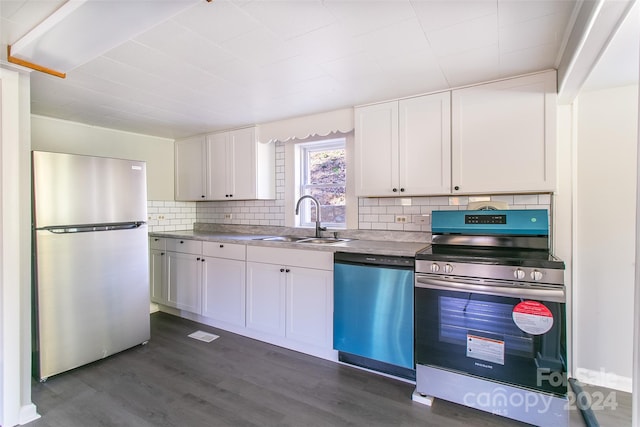 kitchen featuring white cabinetry, stainless steel appliances, sink, and dark hardwood / wood-style flooring