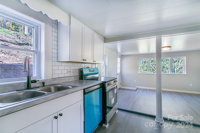 kitchen featuring tasteful backsplash, sink, dark hardwood / wood-style flooring, stainless steel appliances, and white cabinets