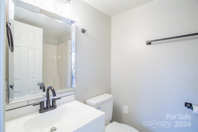 bathroom with vanity and toilet