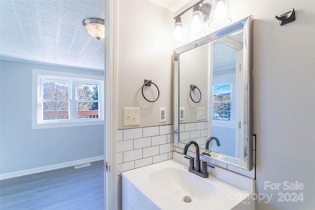 bathroom with vanity and hardwood / wood-style floors