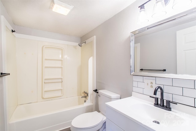 full bathroom featuring vanity, shower / washtub combination, toilet, and tasteful backsplash