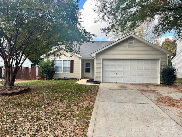 single story home with a front yard and a garage