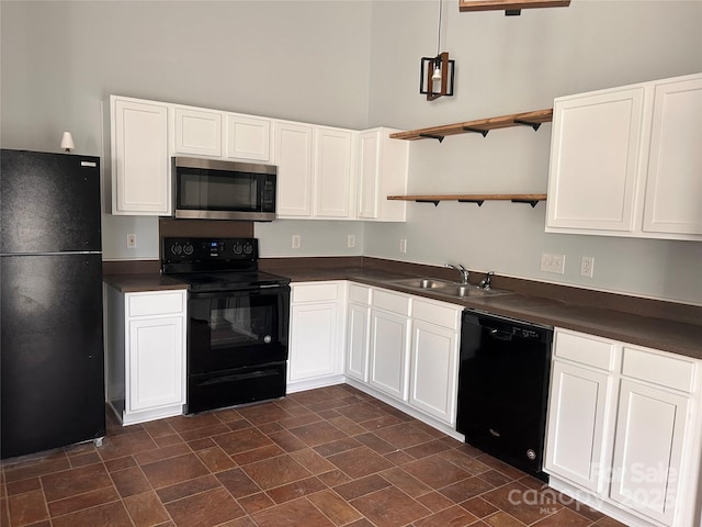 kitchen with sink, white cabinetry, and black appliances