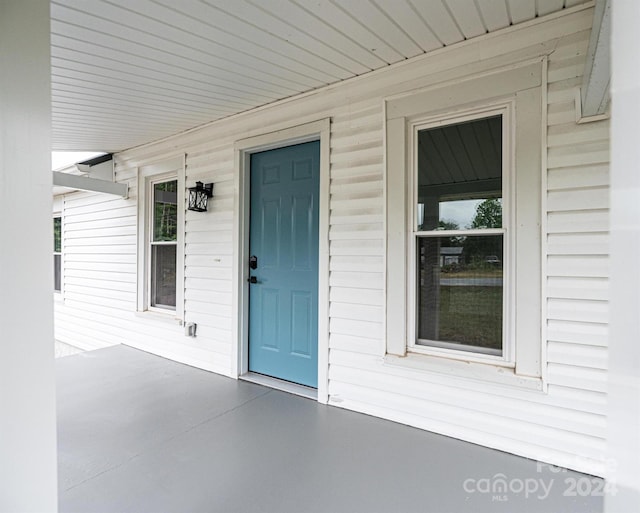 doorway to property with a porch