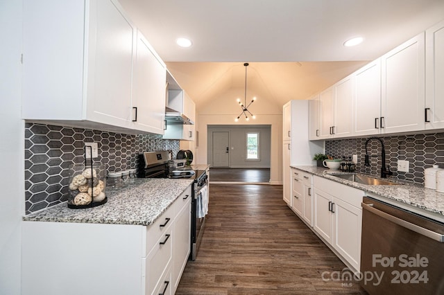 kitchen featuring white cabinetry, stainless steel appliances, sink, and vaulted ceiling