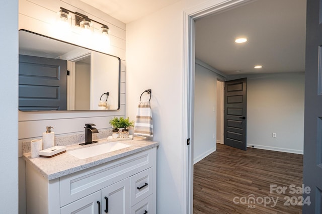 bathroom featuring vanity and hardwood / wood-style flooring