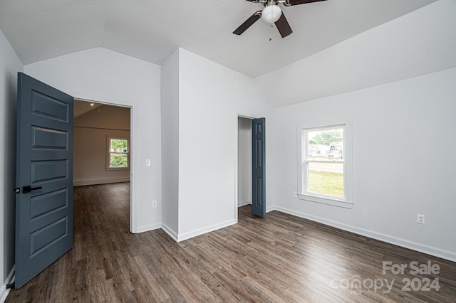 spare room featuring ceiling fan, vaulted ceiling, and dark hardwood / wood-style flooring