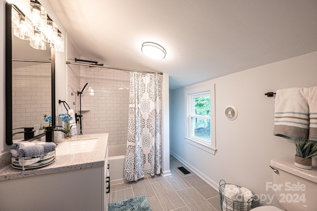 full bathroom featuring toilet, vanity, and shower / bath combination with curtain