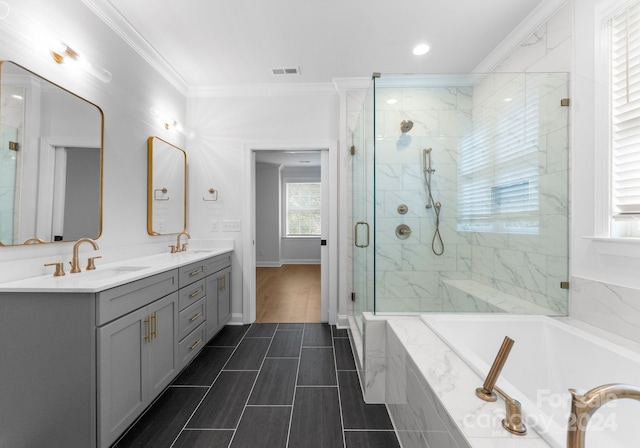 bathroom featuring vanity, ornamental molding, hardwood / wood-style floors, and separate shower and tub