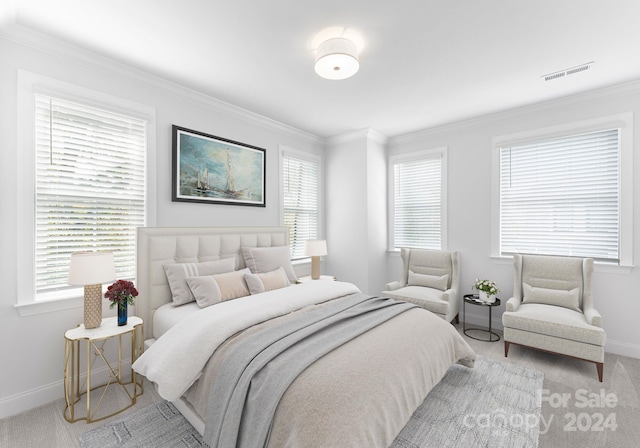 bedroom with crown molding, multiple windows, and light colored carpet