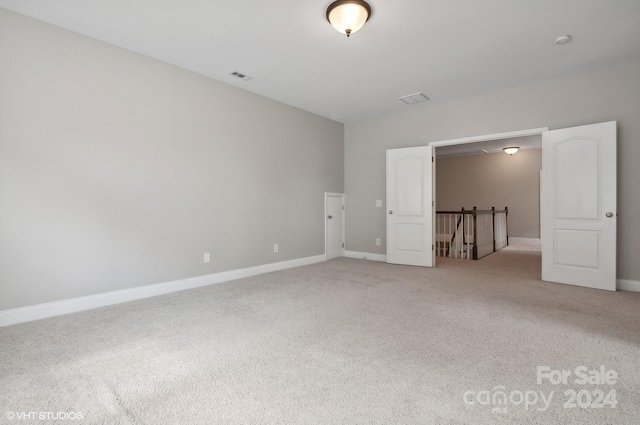 unfurnished bedroom with light carpet