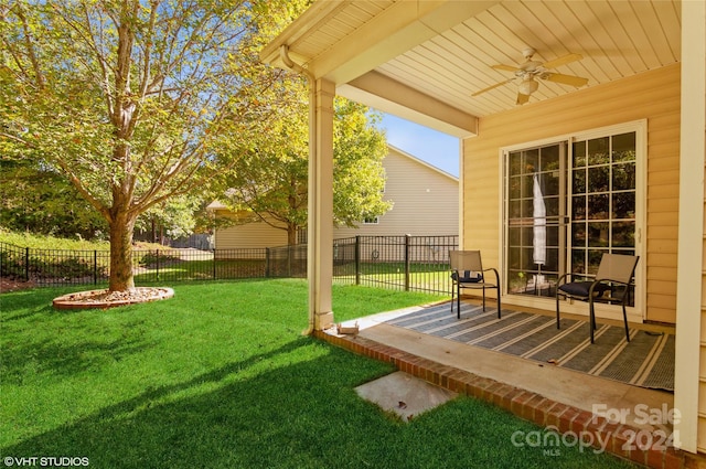 view of yard featuring a patio and ceiling fan