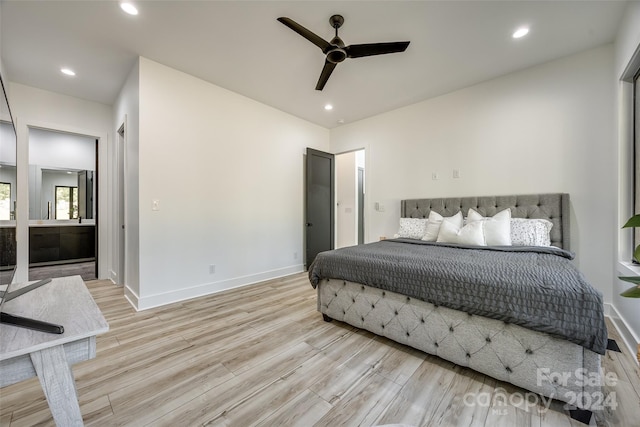 bedroom with light hardwood / wood-style floors and ceiling fan