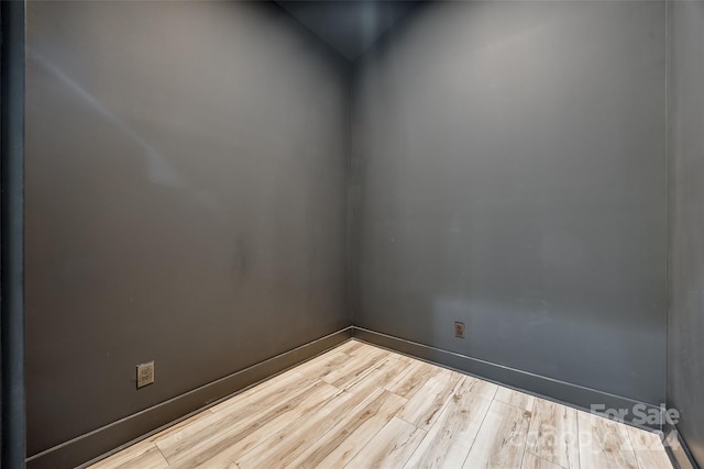 empty room with wood-type flooring