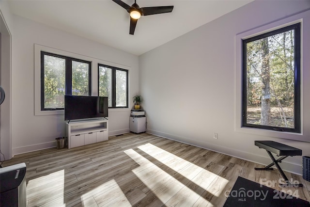 unfurnished living room with light hardwood / wood-style floors and ceiling fan