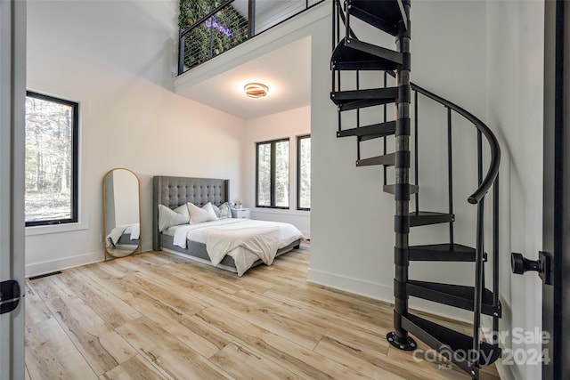 bedroom with light hardwood / wood-style flooring