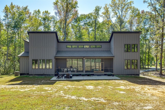 back of property featuring a yard and a patio area