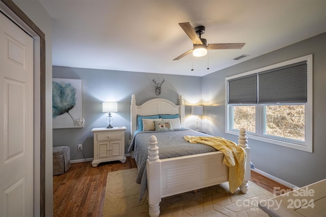 bedroom with hardwood / wood-style floors and ceiling fan