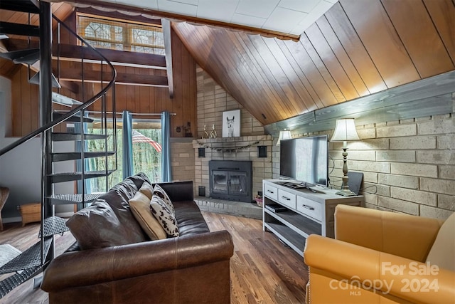 living room featuring wood-type flooring, wooden ceiling, vaulted ceiling, a brick fireplace, and wood walls