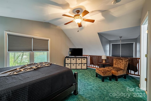 bedroom with ceiling fan, vaulted ceiling, and carpet floors