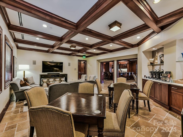 dining space featuring beam ceiling and coffered ceiling