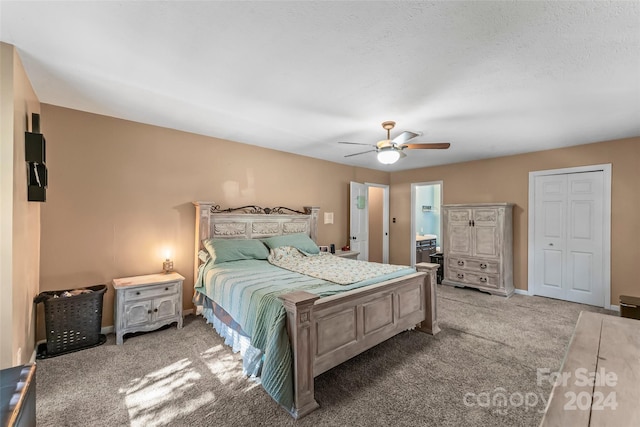 bedroom with a closet, ceiling fan, a textured ceiling, and light colored carpet