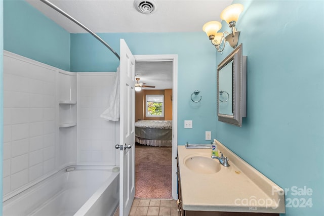 bathroom with shower / bath combination, vanity, ceiling fan, and tile patterned flooring