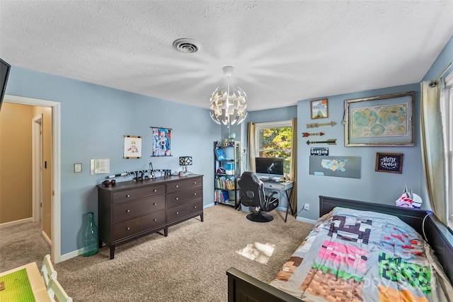 bedroom featuring a notable chandelier, a textured ceiling, and light colored carpet