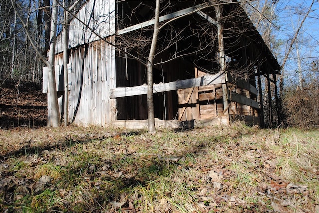 view of property exterior featuring an outbuilding