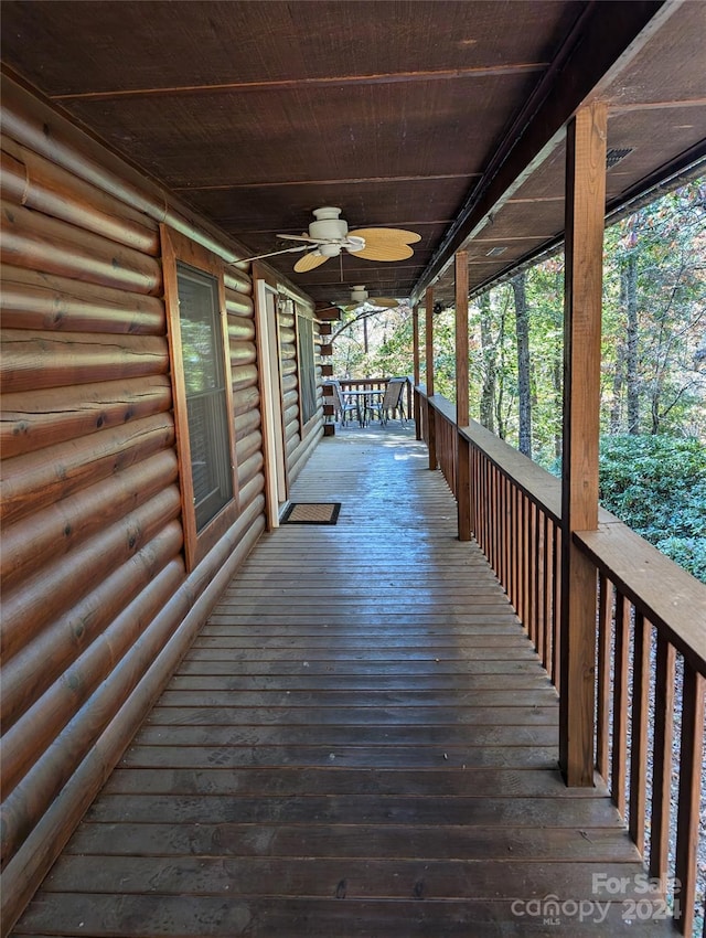 wooden terrace with ceiling fan