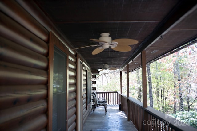 wooden deck featuring ceiling fan