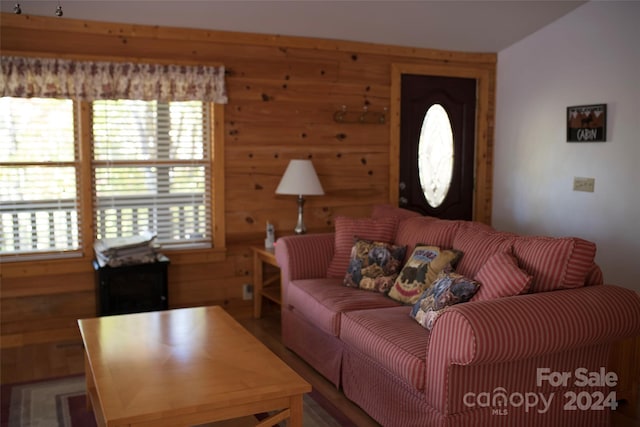 living room with wooden walls