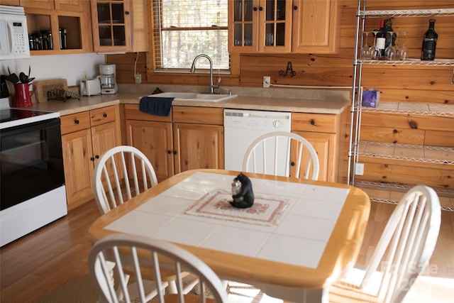 kitchen with white appliances, light brown cabinetry, sink, tile counters, and dark wood-type flooring