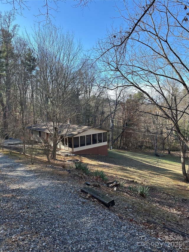 view of front of property featuring a sunroom