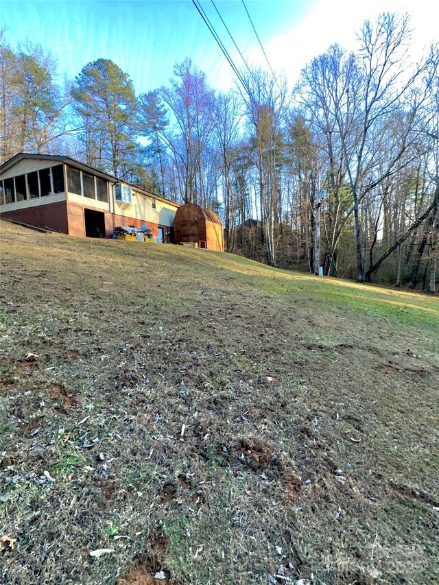 view of yard featuring a sunroom