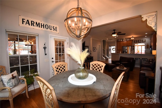 dining room with ceiling fan and dark hardwood / wood-style flooring