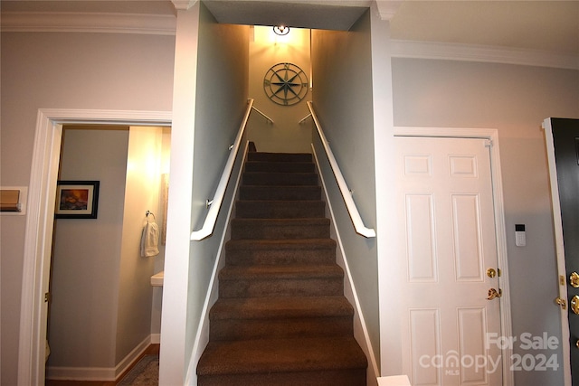 staircase with ornamental molding