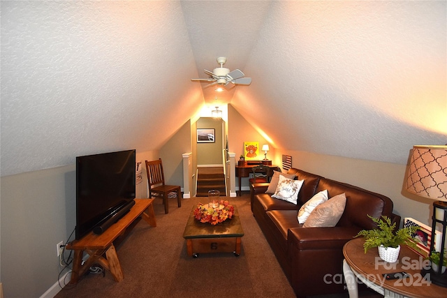 living room with a textured ceiling, ceiling fan, carpet flooring, and vaulted ceiling