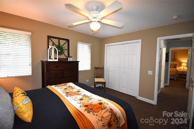 carpeted bedroom with multiple windows, a closet, and ceiling fan