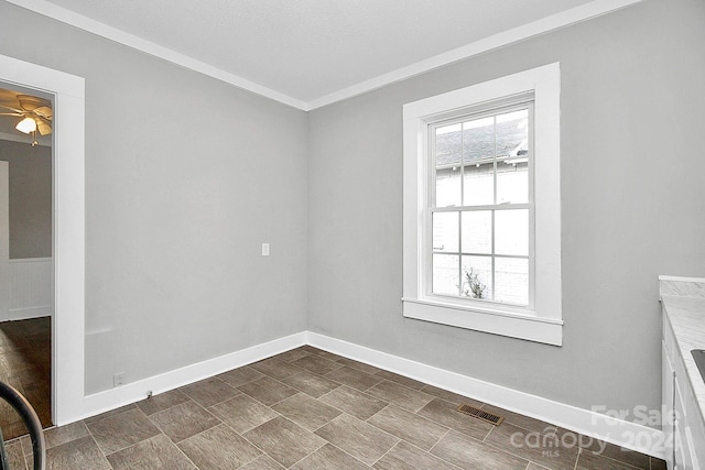 unfurnished room featuring ceiling fan