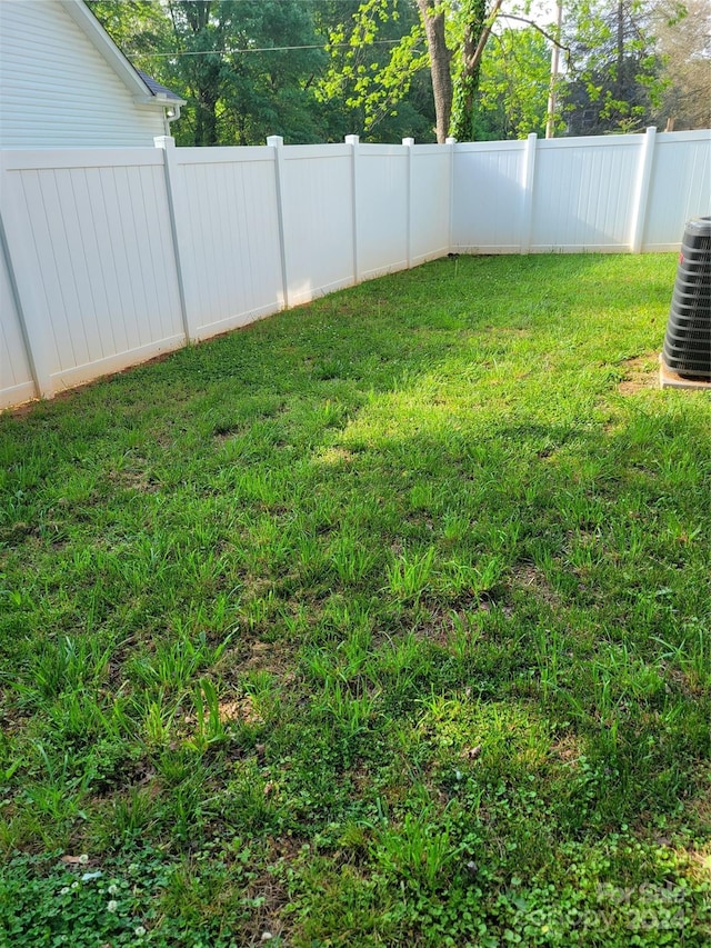 view of yard featuring central AC