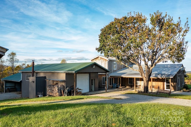 view of front of property with a front yard and a garage