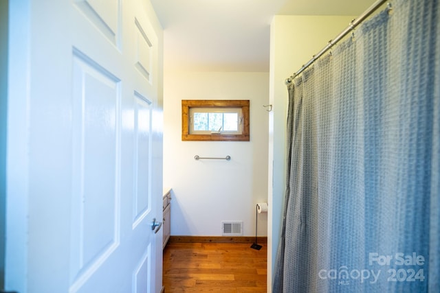 200 Bp Tree Farm Ln, Sparta, NC 28675 - full bathroom with wood finished floors, vanity, baseboards, and a shower with shower curtain