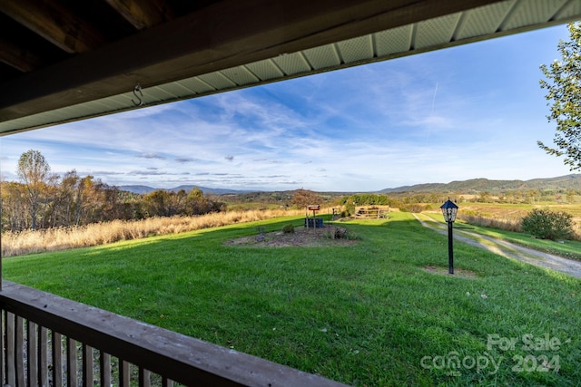 view of yard featuring a mountain view and a rural view