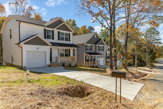 view of property featuring covered porch and a garage