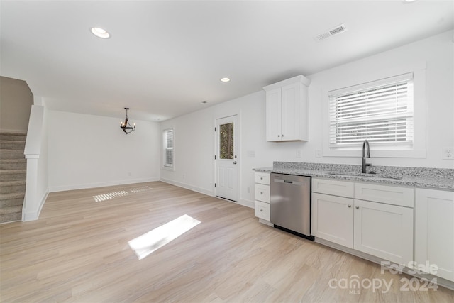 kitchen with light stone countertops, sink, dishwasher, light wood-type flooring, and white cabinets