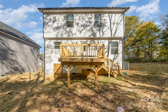 rear view of house with central AC and a deck