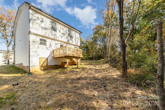 rear view of house featuring a deck