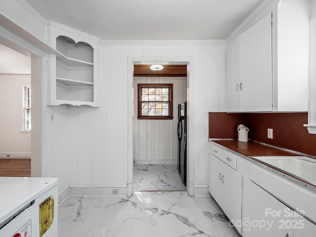 kitchen featuring open shelves, marble finish floor, baseboards, and white cabinets