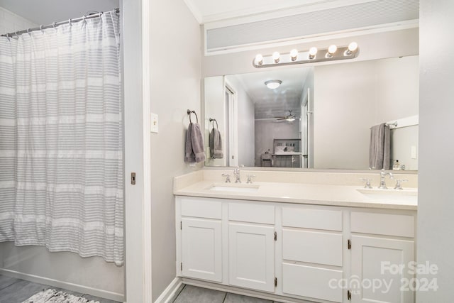 bathroom featuring vanity, ceiling fan, crown molding, and a shower with shower curtain